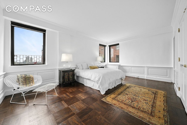 12 Beekman Place Pha, New York City, NY 10022 - bedroom featuring a decorative wall, crown molding, and a wainscoted wall