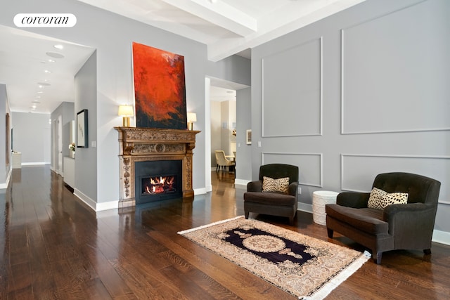 415 Greenwich St Unit 5H, New York City, NY 10013 - living area with hardwood / wood-style flooring, a warm lit fireplace, beamed ceiling, baseboards, and recessed lighting
