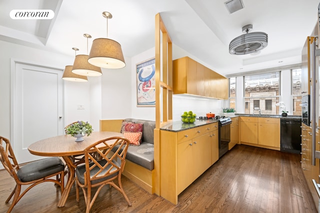 135 E 74th St Unit 11Bc, New York City, NY 10021 - kitchen with range with gas cooktop, dishwasher, dark wood-style flooring, and dark countertops