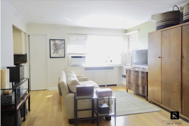 233 E 69th St Unit 3-O, New York City, NY 10021 - living room featuring crown molding, light wood-type flooring, and cooling unit