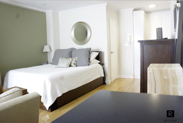 233 E 69th St Unit 3-O, New York City, NY 10021 - bedroom featuring crown molding, light wood-style flooring, recessed lighting, and baseboards