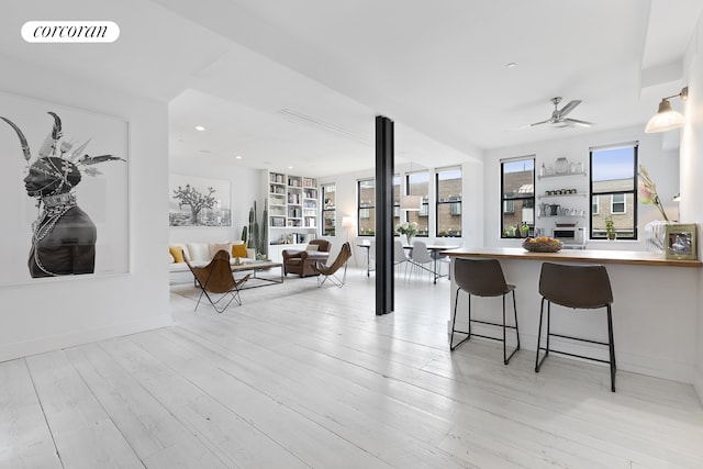 138 Broadway Unit 5G, New York City, NY 11211 - living room with ceiling fan, light wood finished floors, and recessed lighting
