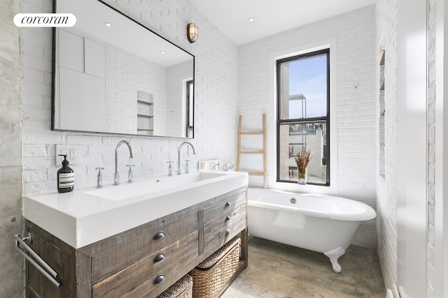 138 Broadway Unit 5G, New York City, NY 11211 - bathroom featuring a soaking tub, vanity, and concrete floors