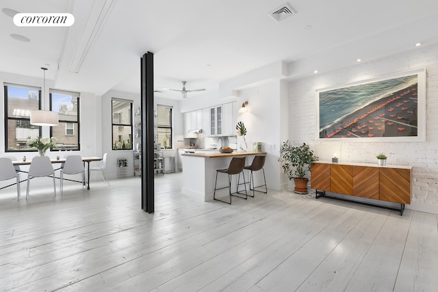 138 Broadway Unit 5G, New York City, NY 11211 - living room with light wood finished floors and a ceiling fan