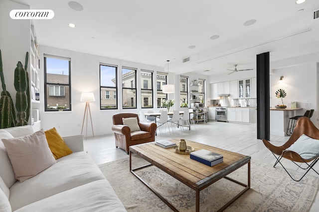 138 Broadway Unit 5G, New York City, NY 11211 - living room featuring light wood finished floors, a ceiling fan, and recessed lighting