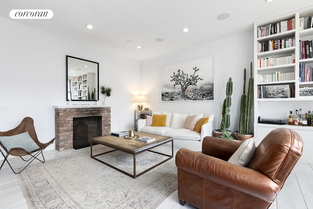 138 Broadway Unit 5G, New York City, NY 11211 - living area with recessed lighting, a brick fireplace, and wood finished floors