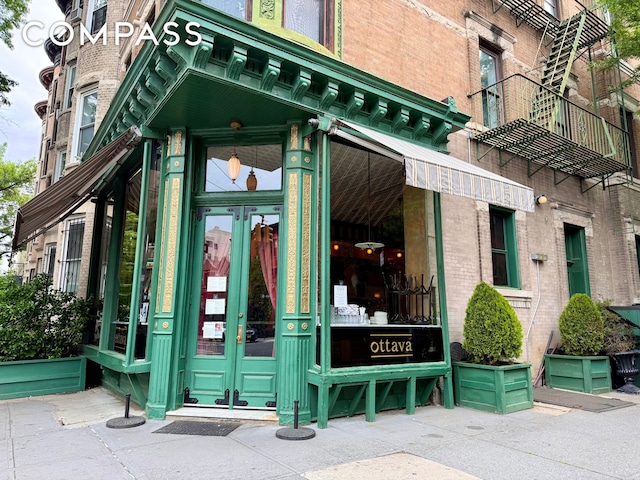 491 12th St Unit 2, New York City, NY 11215 - view of exterior entry featuring french doors and brick siding