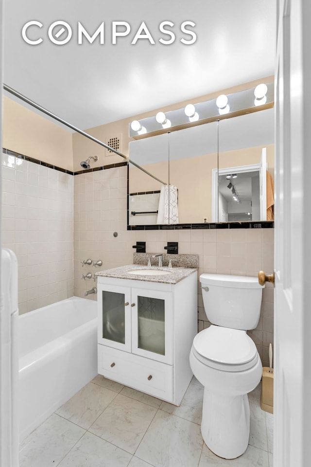 750 Kappock St Unit 307, New York City, NY 10463 - bathroom with vanity, shower / tub combo, and tile walls