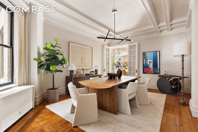 270 Riverside Dr Unit 2C, New York City, NY 10025 - dining space with radiator, a chandelier, crown molding, baseboards, and coffered ceiling