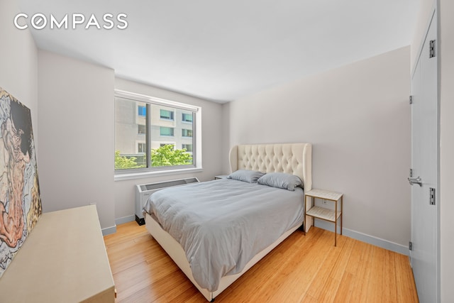 40 W 116th St Unit B302, New York City, NY 10026 - bedroom featuring light wood finished floors and baseboards