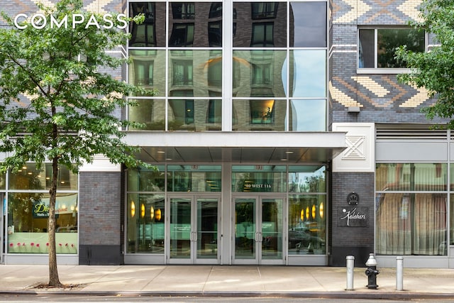 40 W 116th St Unit B302, New York City, NY 10026 - property entrance with french doors and brick siding