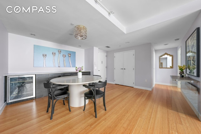 40 W 116th St Unit B302, New York City, NY 10026 - dining space featuring beverage cooler, light wood-type flooring, and baseboards