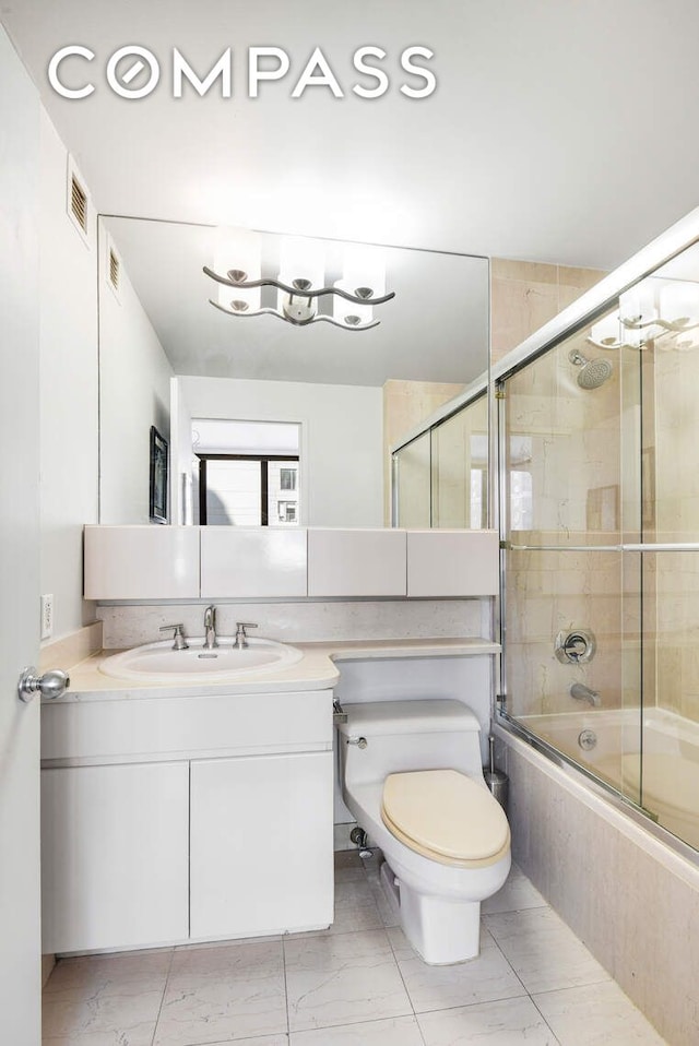 455 E 86th St Unit 8D, New York City, NY 10028 - bathroom featuring tiled shower / bath combo, toilet, vanity, and marble look tile flooring