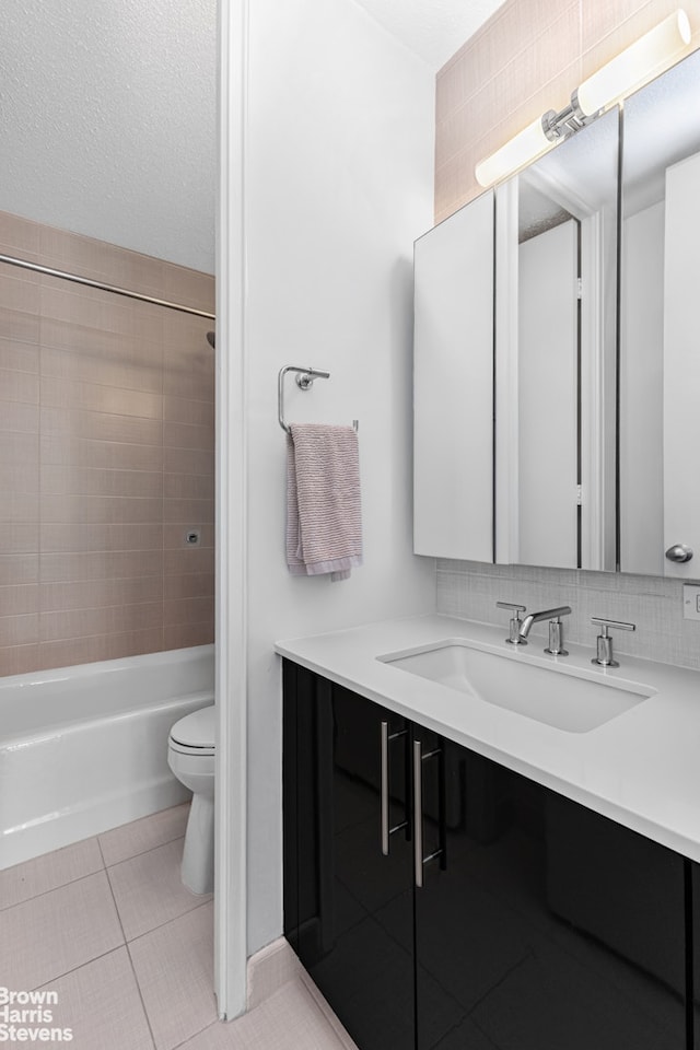 300 E 40th St Unit 20S, New York City, NY 10016 - bathroom featuring vanity, toilet, tile patterned flooring, and bathtub / shower combination