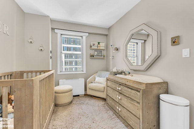 300 E 40th St Unit 20S, New York City, NY 10016 - bedroom with a crib and baseboards