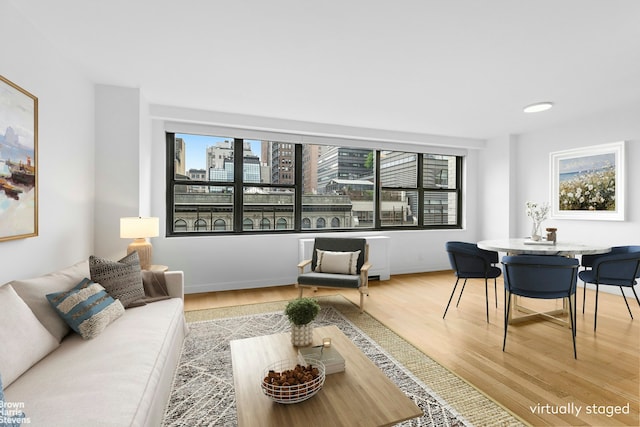7 E 14th St Unit 905, New York City, NY 10003 - living area featuring plenty of natural light and light wood-type flooring