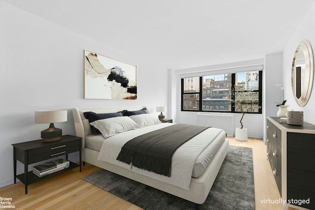 7 E 14th St Unit 905, New York City, NY 10003 - bedroom featuring light wood-style flooring and radiator