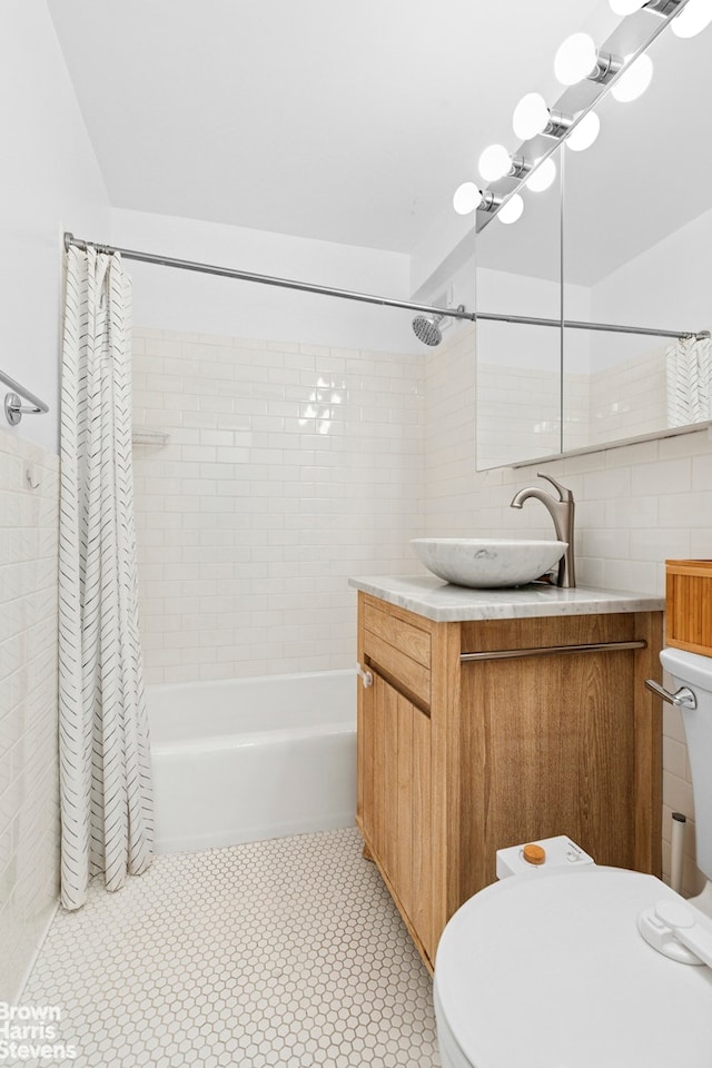 7 E 14th St Unit 905, New York City, NY 10003 - full bath with shower / bath combo with shower curtain, tile walls, and vanity