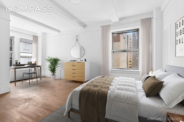 250 W 94th St Unit 8J, New York City, NY 10025 - bedroom with beam ceiling and wood finished floors