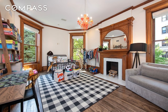 430 W 147th St, New York City, NY 10031 - bedroom with wood finished floors, a chandelier, ornamental molding, and a fireplace with flush hearth