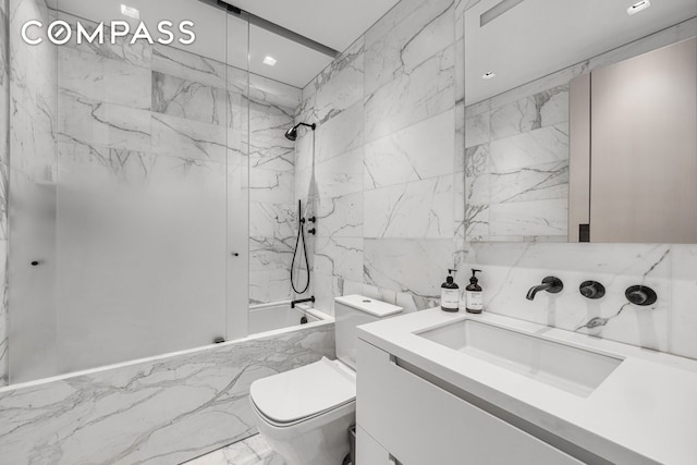 301 W 57th St Unit 36C, New York City, NY 10019 - full bath with marble tiled floors, vanity, a combined bath / shower with marble appearance, toilet, and tile walls