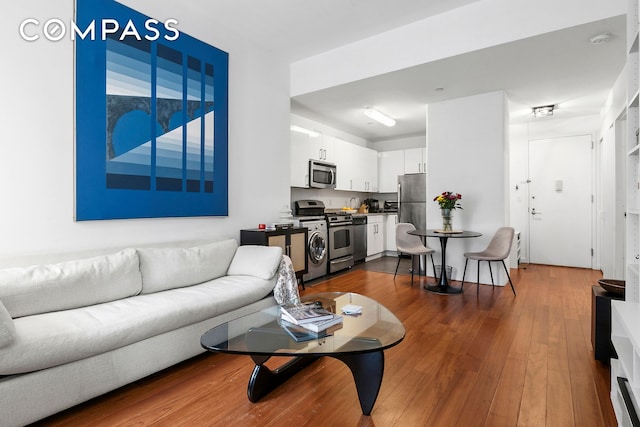 184 Kent Ave Unit D101, New York City, NY 11249 - living area with dark wood-style flooring