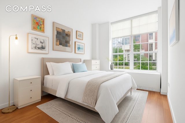 184 Kent Ave Unit D101, New York City, NY 11249 - bedroom featuring wood finished floors and baseboards