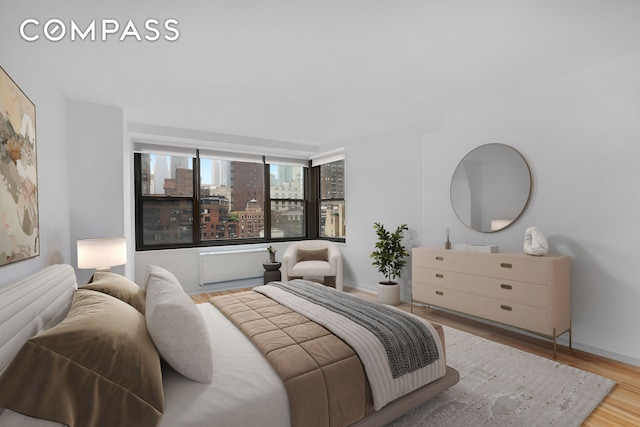 35 E 38th St Unit 12B, New York City, NY 10016 - bedroom featuring wood finished floors and baseboards