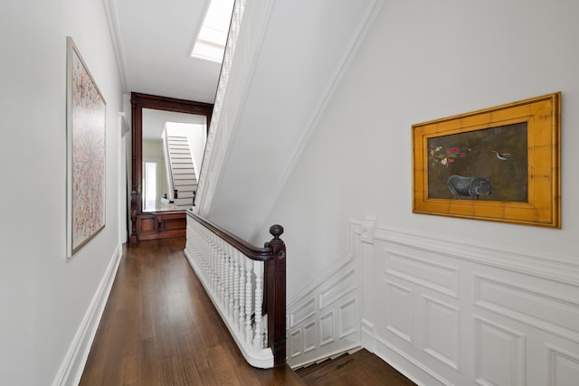 146 St Johns Place, New York City, NY 11217 - stairs with wood finished floors, wainscoting, and a decorative wall