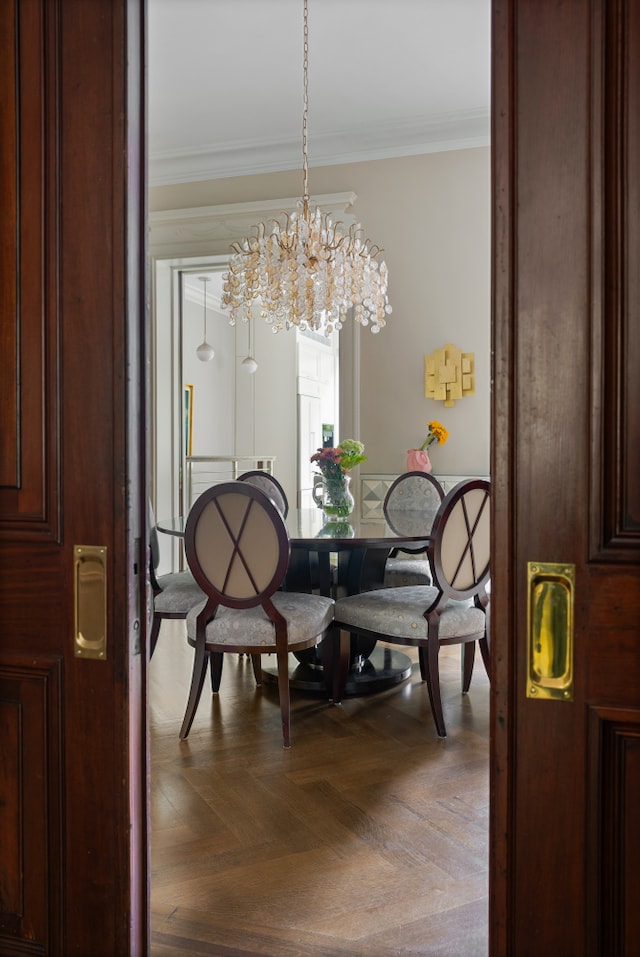 146 St Johns Place, New York City, NY 11217 - dining space with ornamental molding and a chandelier