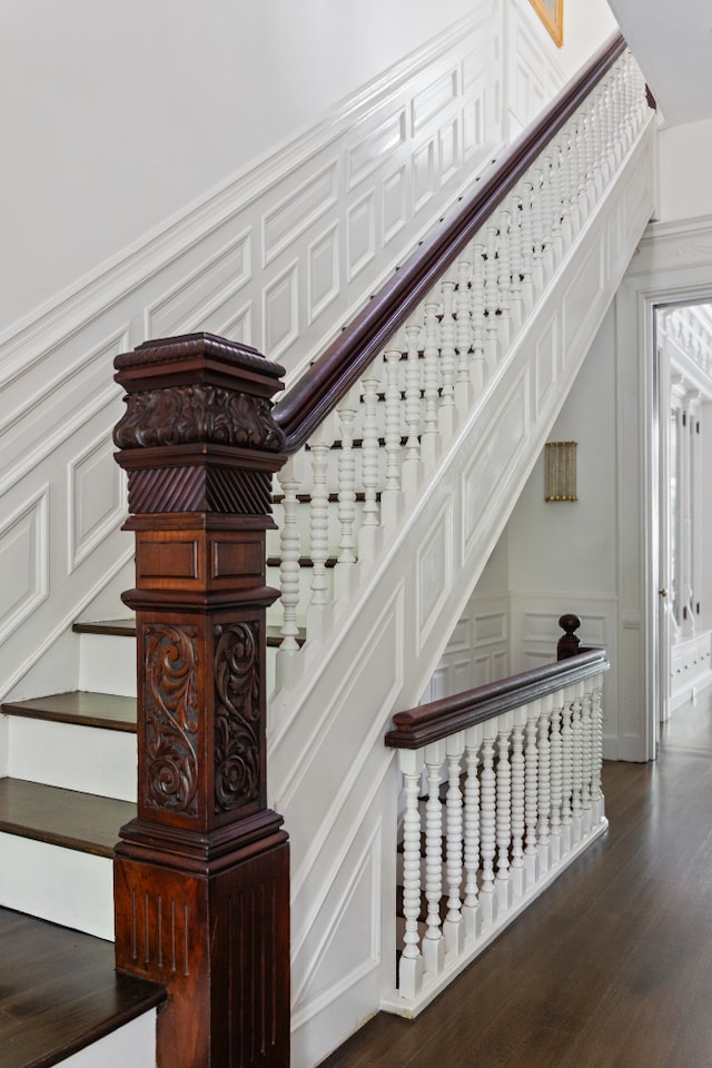 146 St Johns Place, New York City, NY 11217 - staircase featuring a decorative wall, wood finished floors, and a wainscoted wall