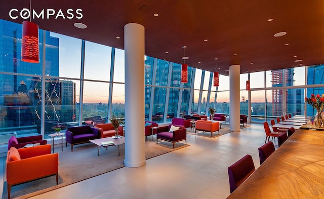 322 W 57th St Unit 33U, New York City, NY 10019 - common area with expansive windows and a towering ceiling