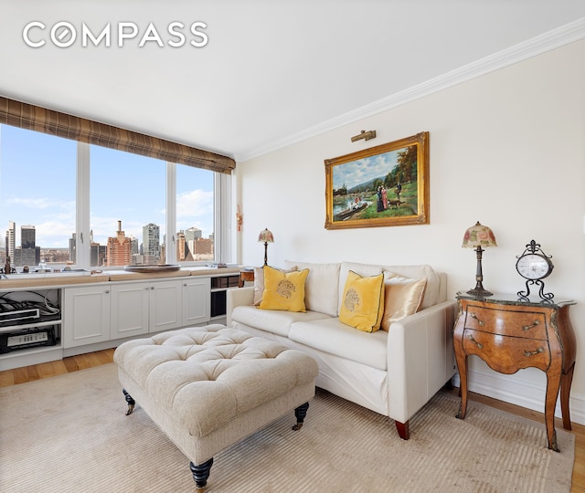322 W 57th St Unit 33U, New York City, NY 10019 - living room featuring light wood finished floors, a view of skyline, and ornamental molding