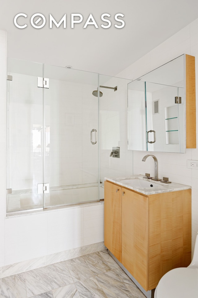 322 W 57th St Unit 33U, New York City, NY 10019 - bathroom featuring vanity and marble finish flooring