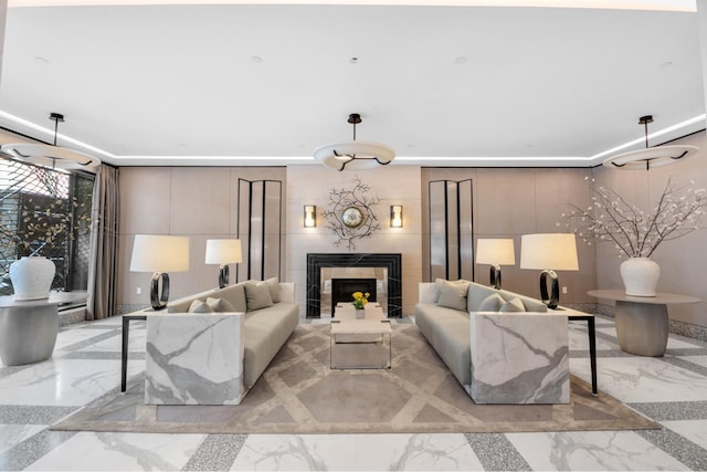 40 Bleecker St Unit 3H, New York City, NY 10012 - living room featuring marble tiled floors and a fireplace
