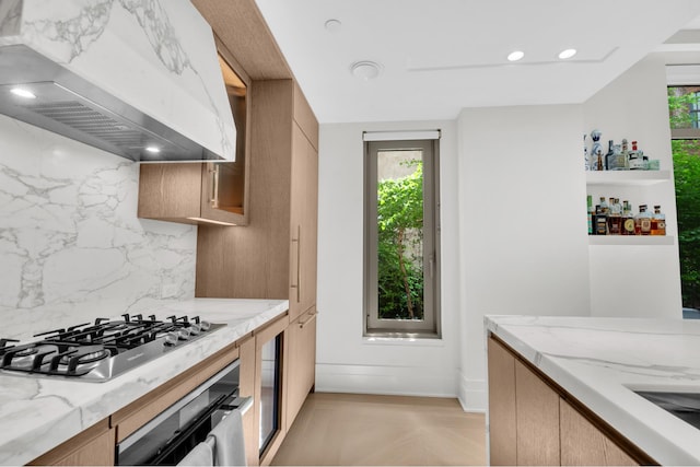 40 Bleecker St Unit 3H, New York City, NY 10012 - kitchen featuring extractor fan, stainless steel appliances, healthy amount of natural light, and backsplash