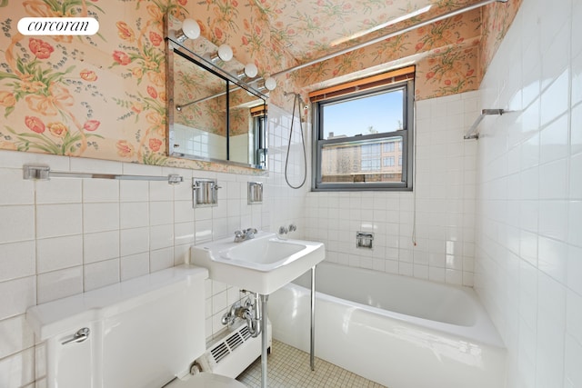 360 E 72nd St Unit C2003, New York City, NY 10021 - full bath featuring tile walls, wallpapered walls, toilet, tile patterned flooring, and bathing tub / shower combination