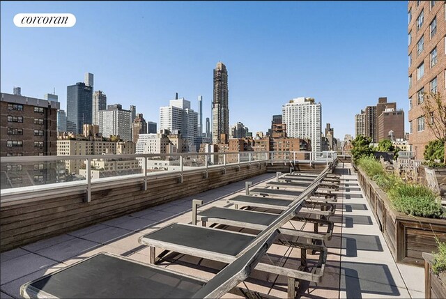360 E 72nd St Unit C2003, New York City, NY 10021 - view of patio featuring a skyline view