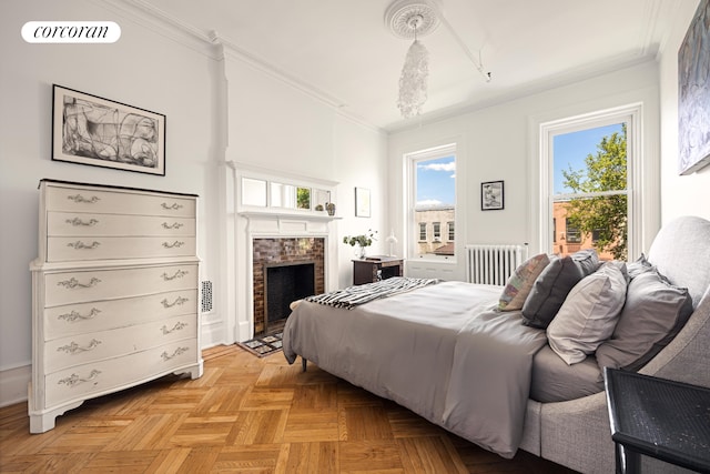 151 Herkimer St, New York City, NY 11216 - bedroom featuring radiator heating unit, ornamental molding, a fireplace, and access to exterior