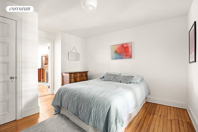 151 Herkimer St, New York City, NY 11216 - bedroom with hardwood / wood-style flooring and baseboards