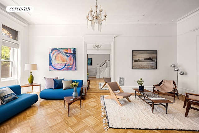 151 Herkimer St, New York City, NY 11216 - living room featuring ornamental molding, a chandelier, stairs, and baseboards