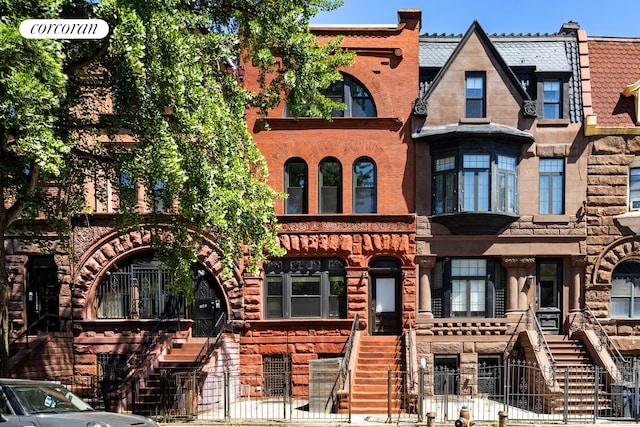 151 Herkimer St, New York City, NY 11216 - view of property featuring stairs and a fenced front yard