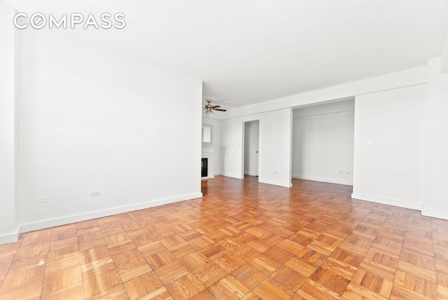 345 W 145th St Unit 8C3, New York City, NY 10031 - unfurnished bedroom featuring a fireplace and baseboards