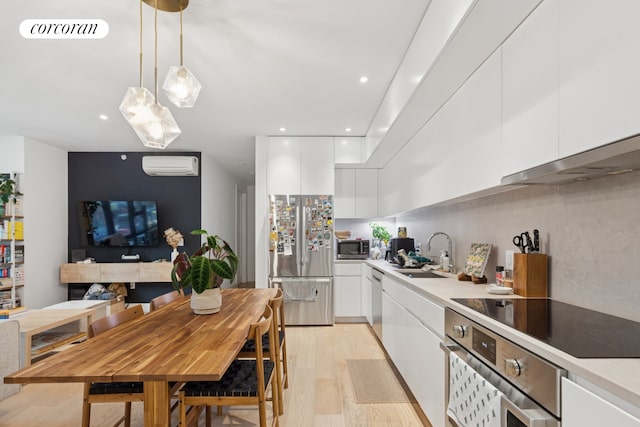 112 Fleet Pl Unit 2A, New York City, NY 11201 - kitchen with stainless steel appliances, modern cabinets, white cabinets, and recessed lighting