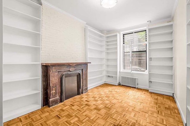 350 W 48th St Unit 1W, New York City, NY 10036 - unfurnished living room featuring radiator and a fireplace