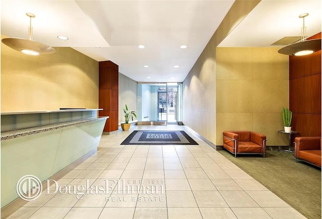 199 Bowery Unit 2D, New York City, NY 10003 - lobby featuring tile walls and recessed lighting
