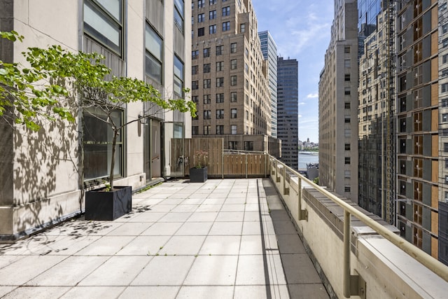 99 John St Unit 1405, New York City, NY 10038 - view of patio / terrace with a water view, a balcony, and a city view