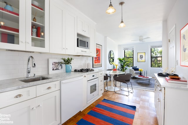 3 4th Pl Unit 6, New York City, NY 11231 - kitchen featuring a sink, appliances with stainless steel finishes, white cabinets, and backsplash