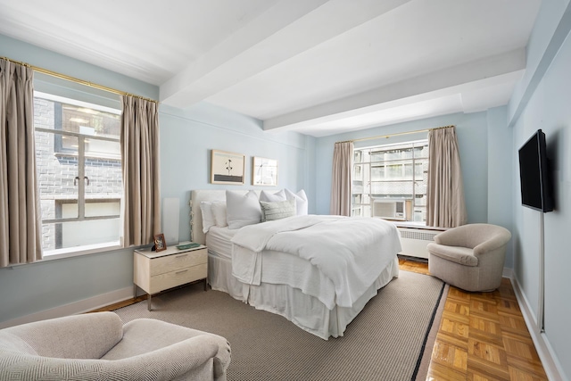 45 W 54th St Unit 11/12A, New York City, NY 10019 - bedroom with radiator heating unit, beam ceiling, and cooling unit