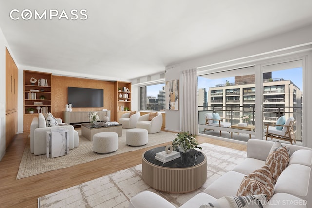 303 E 57th St Unit 33Ef, New York City, NY 10022 - living area with wood finished floors and built in shelves